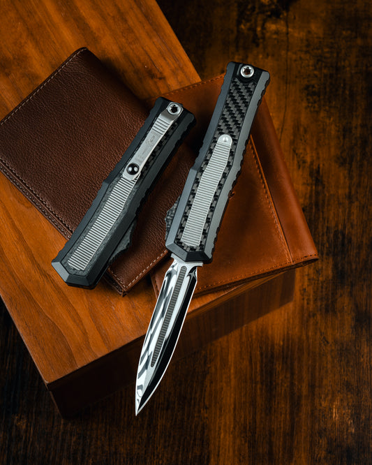 ATREUS-DOUBLE EDGE MIRROR POLISH W/TITANIUM INLAY MIL-SPEC ALLOY W/CARBON FIBER AND TITANIUM INLAY CARBON FIBER BUTTON AND TITANIUM ACCENTS (1290-HPCFTI-MCK)